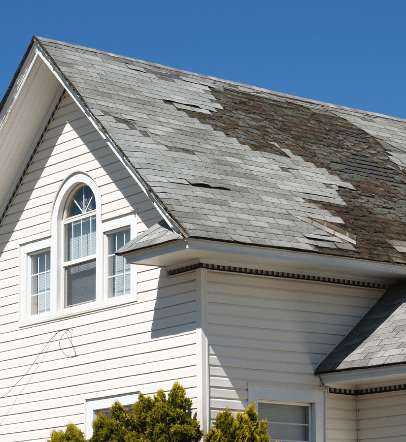 Home with roof in need of repair