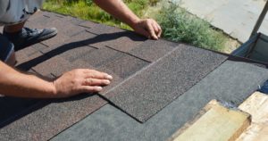 Roofer fixing roof