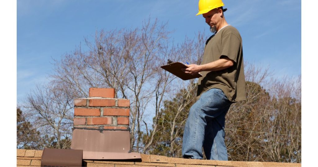 Roofer conducting roof inspection
