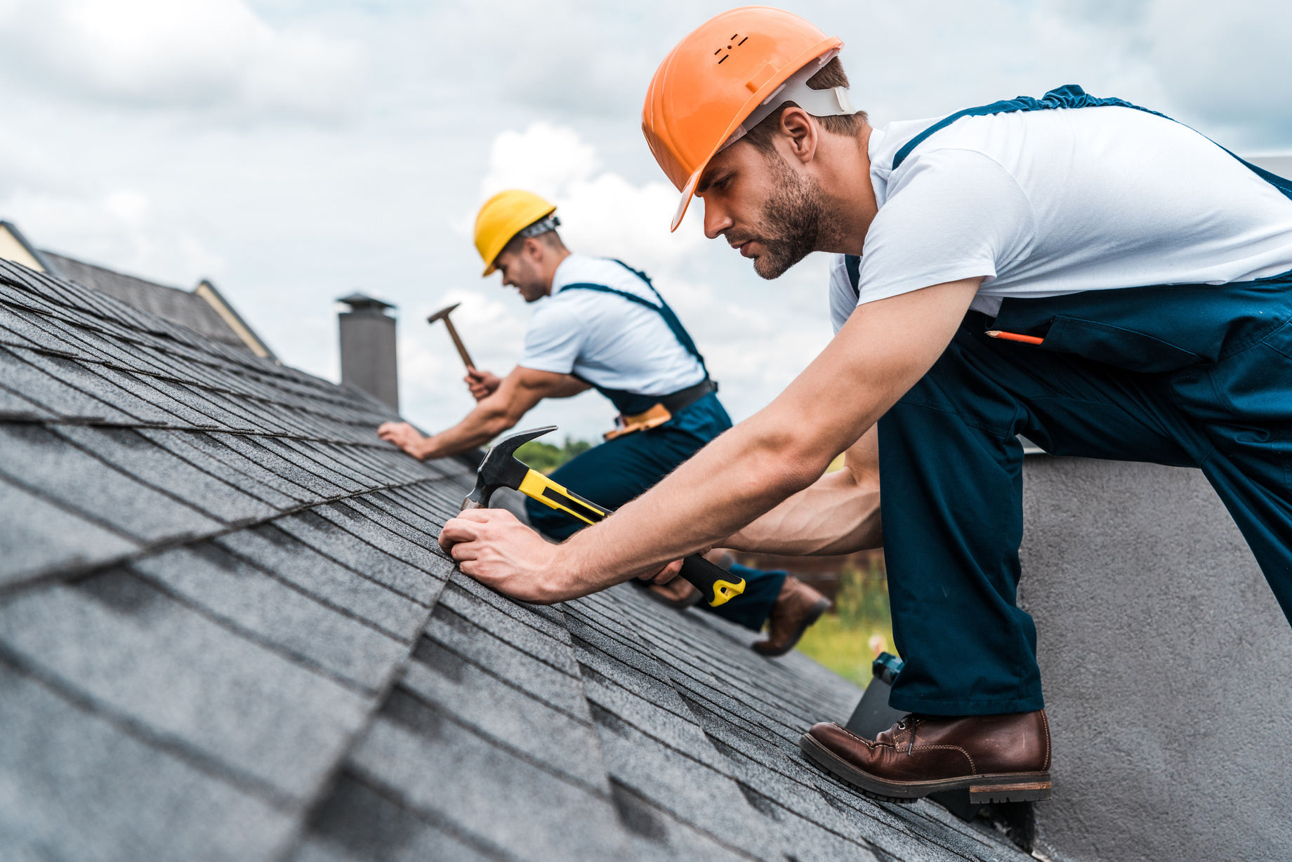 roofing experts working on residential roof