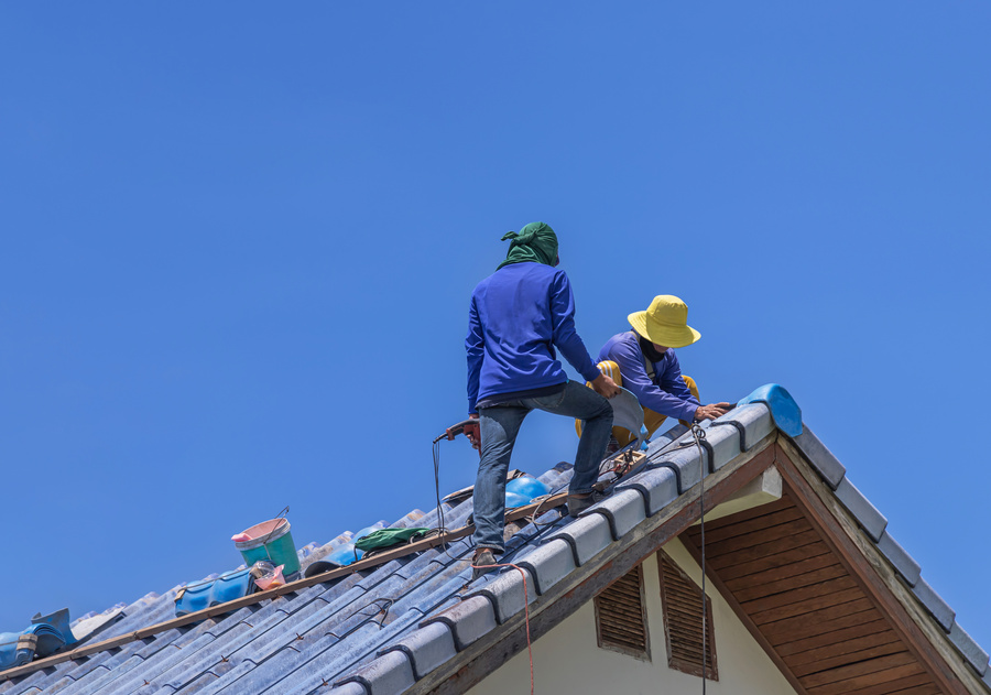 roofing expert working on roof replacement