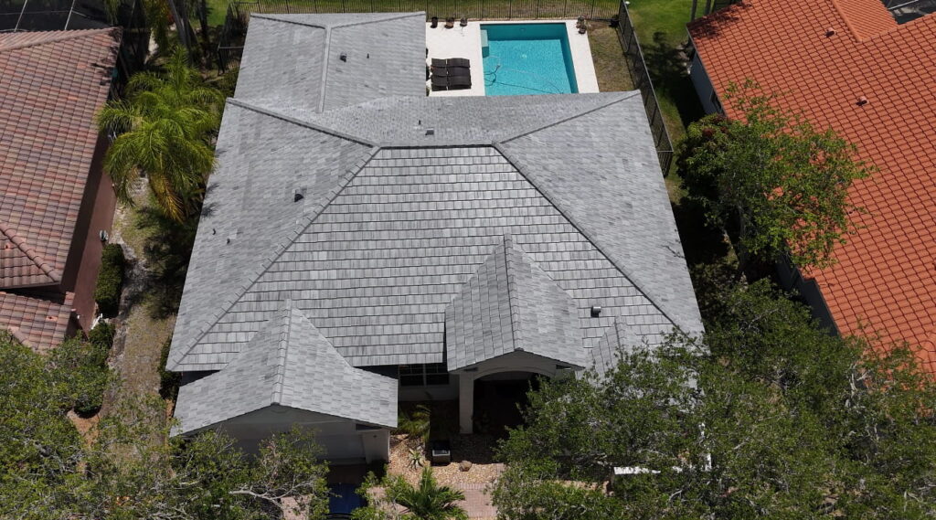 Top-down aerial view of a residential home with an architectural shingle roof in Margate, Florida