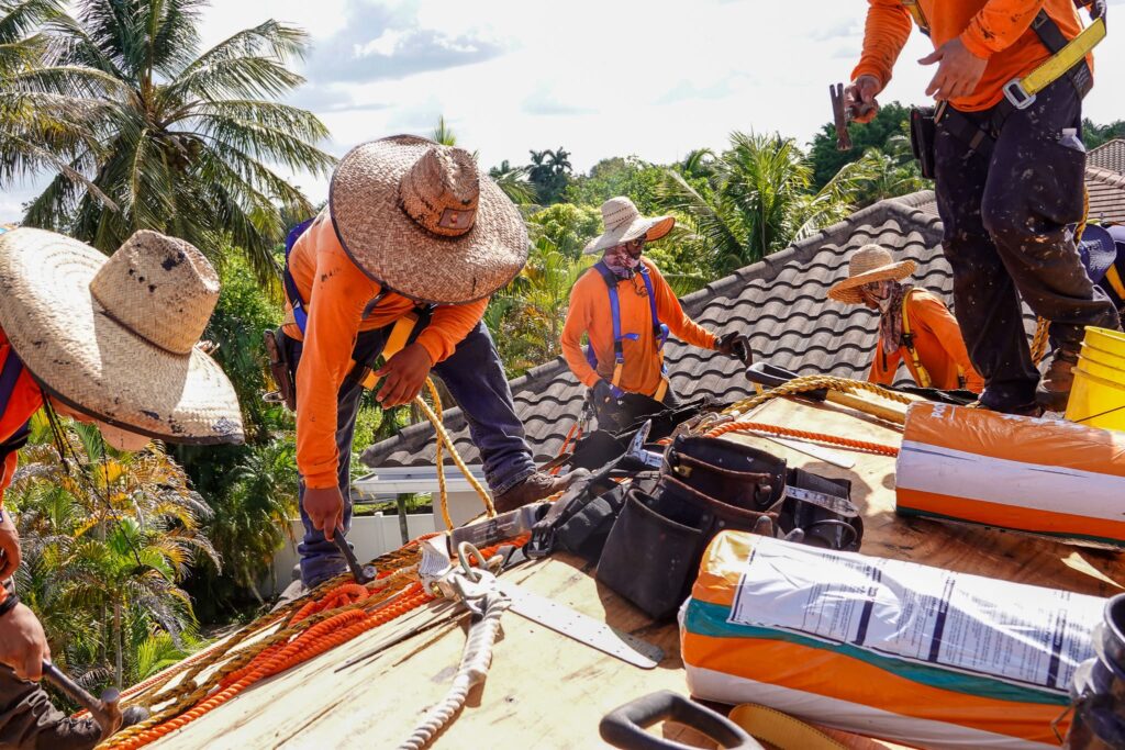 Roofing crew installing a new roof on a South Florida home