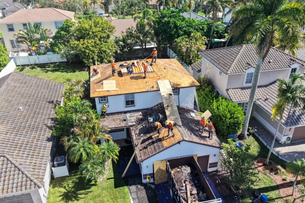 Aerial view of a Tiger Team Roofing replacement underway in a Broward County neighborhood