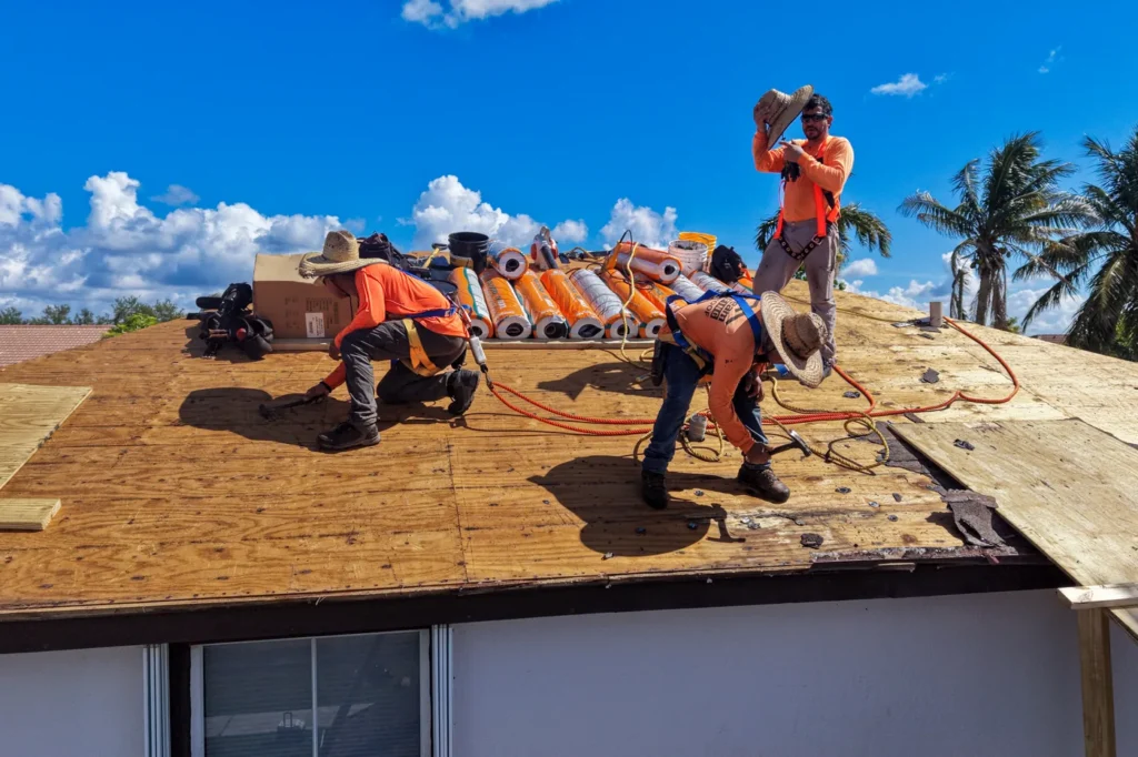 Tiger Team Roofing crew installing new roof decking on a Broward County home