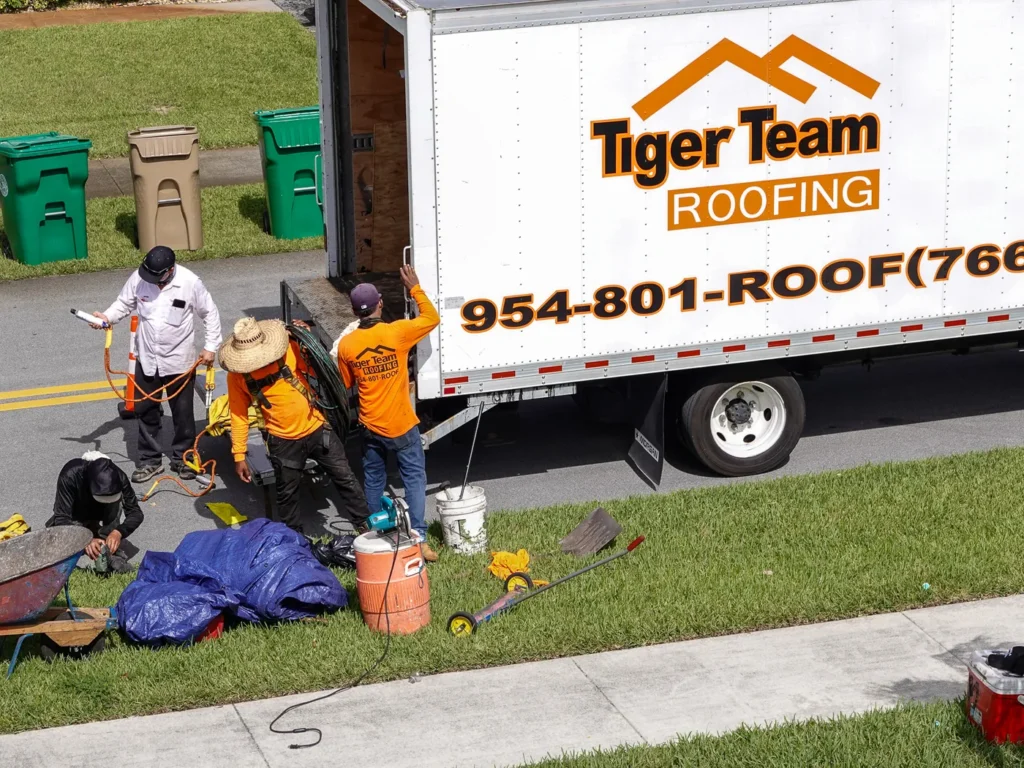 Tiger Team Roofing truck and crew at a Fort Lauderdale roofing job site