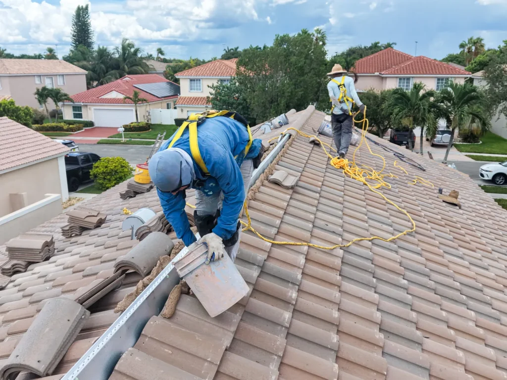 Tiger Team Roofing crew installing a tile roof on a waterfront Fort Lauderdale home